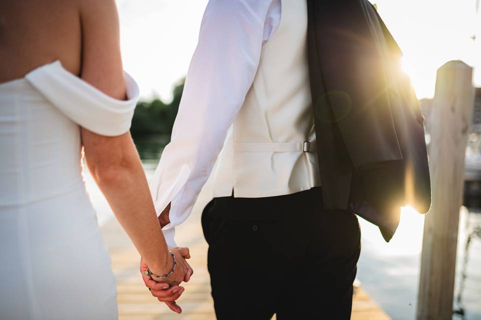 Newlyweds walking at sunset