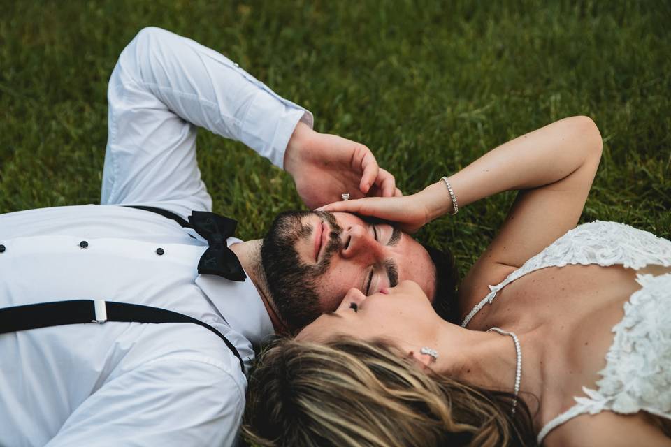 Bride and groom in the grass