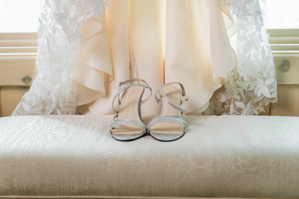 Bridal shoe and dress detail