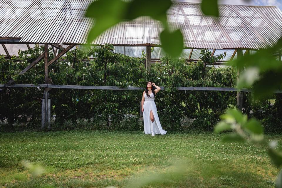 Bride posing at greenhouse