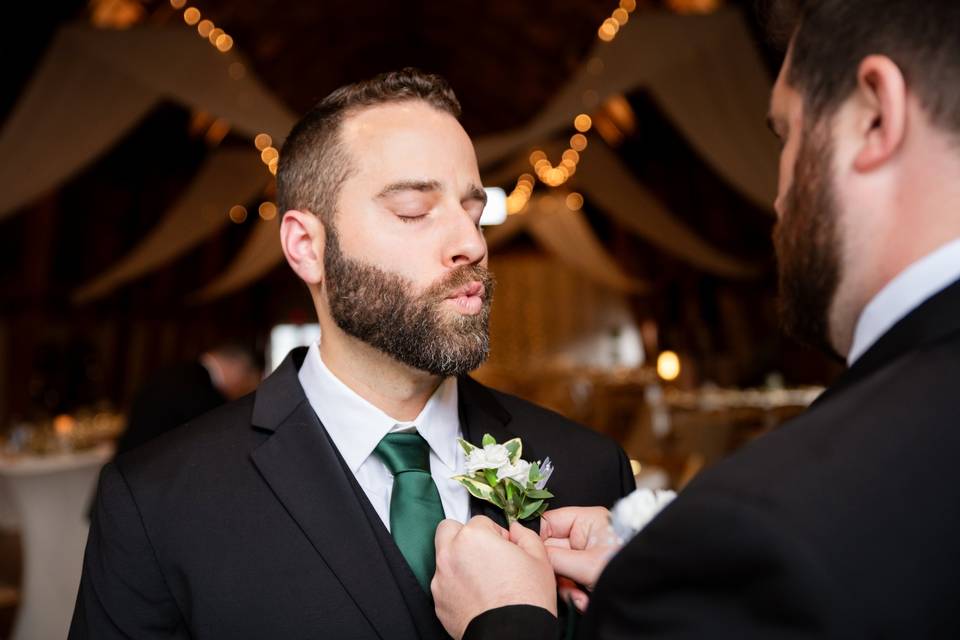 Putting on boutonniere