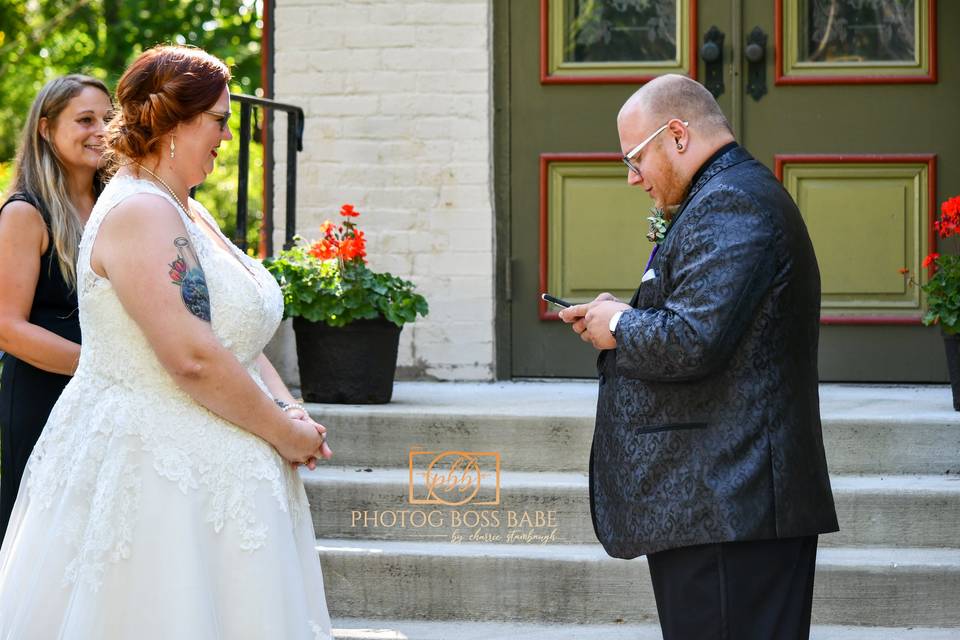 Groom reading vows.