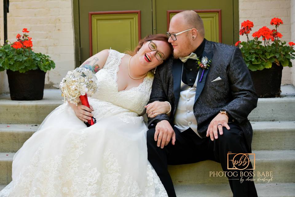 Groom kissing bride.