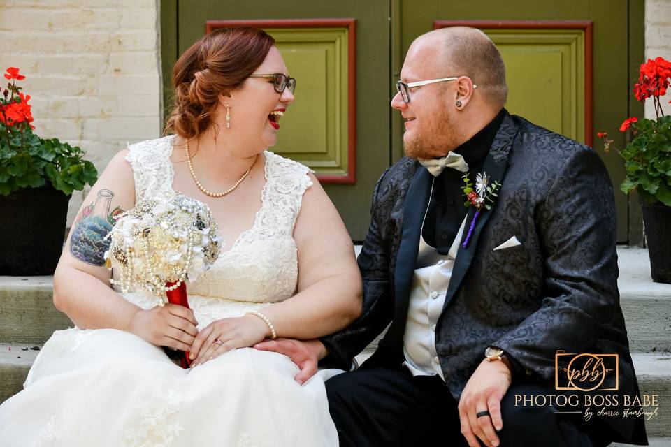 Bride & groom laughing.