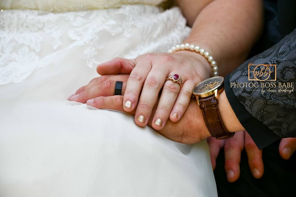 Bride & groom hands.