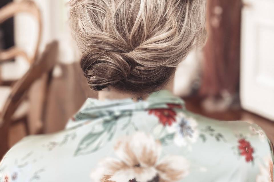Tousled textured low side bun