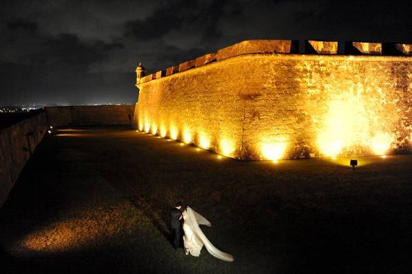 A couple walking through the gardens of San Felipe del Morro Fort in Old San Juan, Puerto Rico