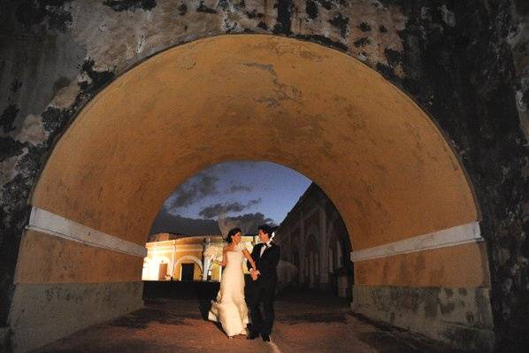 A couple walking through the gardens of San Felipe del Morro Fort in Old San Juan, Puerto Rico