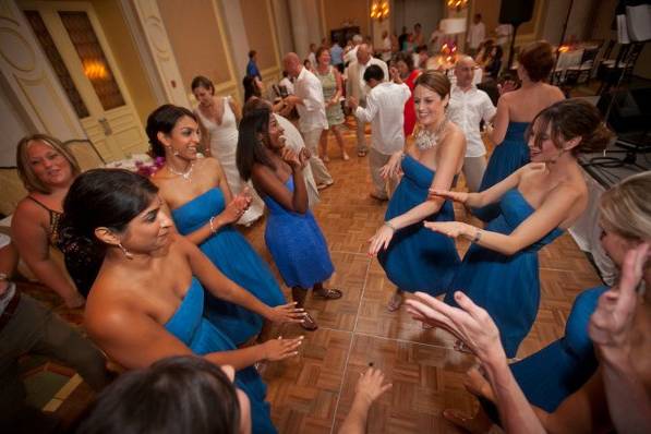 bridesmaids dancing to the band Extasis