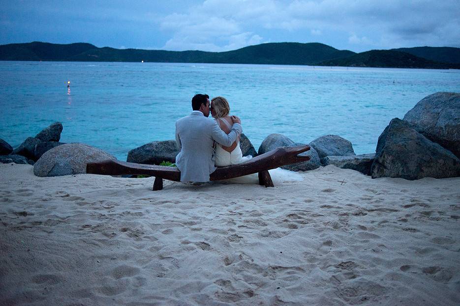 A bride and groom at the beach in Necker Island, BVI after the ceremony at the  Temple House in Necker Island.