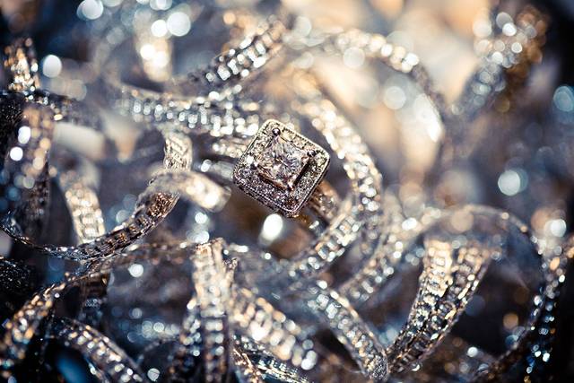 Engagement ring detail shot in reception decorations.