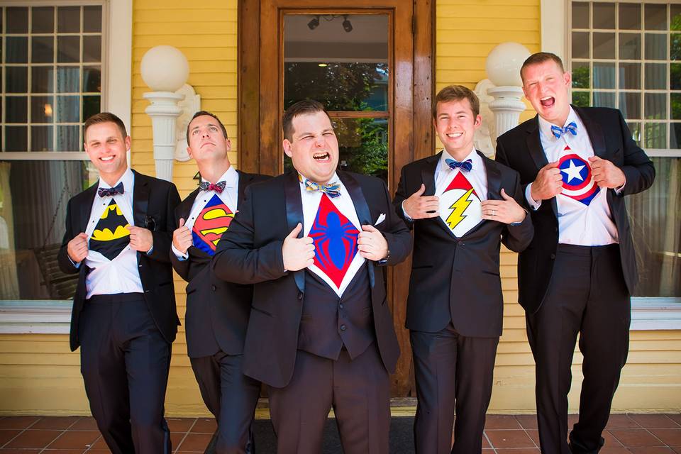 Groom and groomsmen as superheroes in Bloomington outdoor wedding.