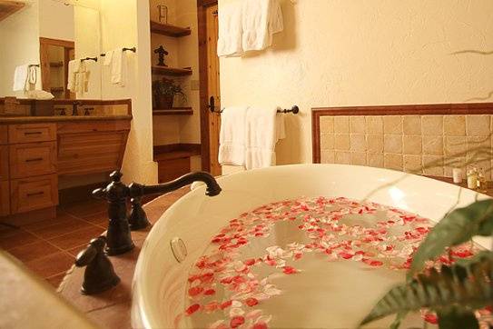 Luxurious bathroom amenities in every room, including bubble tub and large rainfall shower