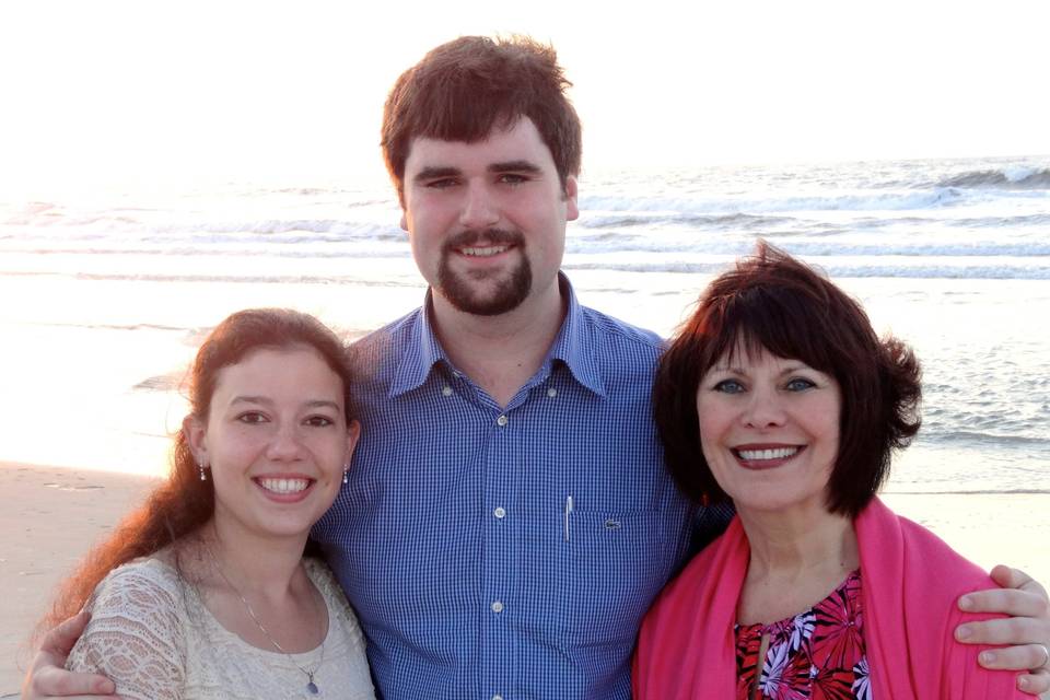 The newlyweds with the officiant