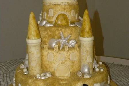 Sand Castle Wedding Cake4-Tiers with every tier being a different flavor and filling!