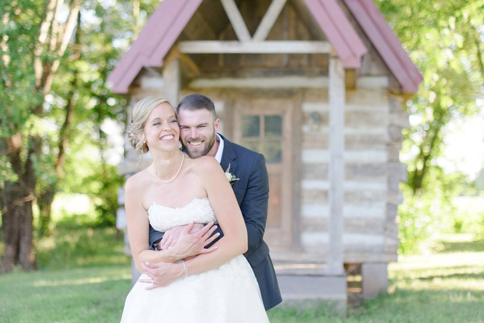 Groom hugging his bride