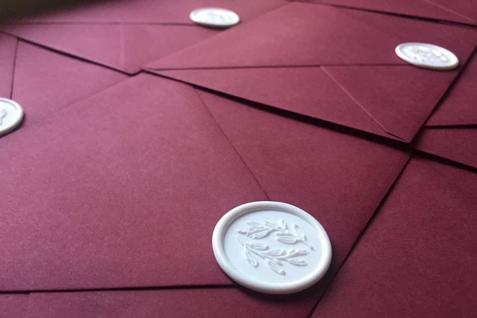 Burgundy with white seals