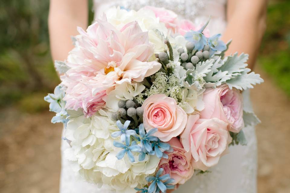 Pastel bridal bouquet with giant dahlias and garden roses.