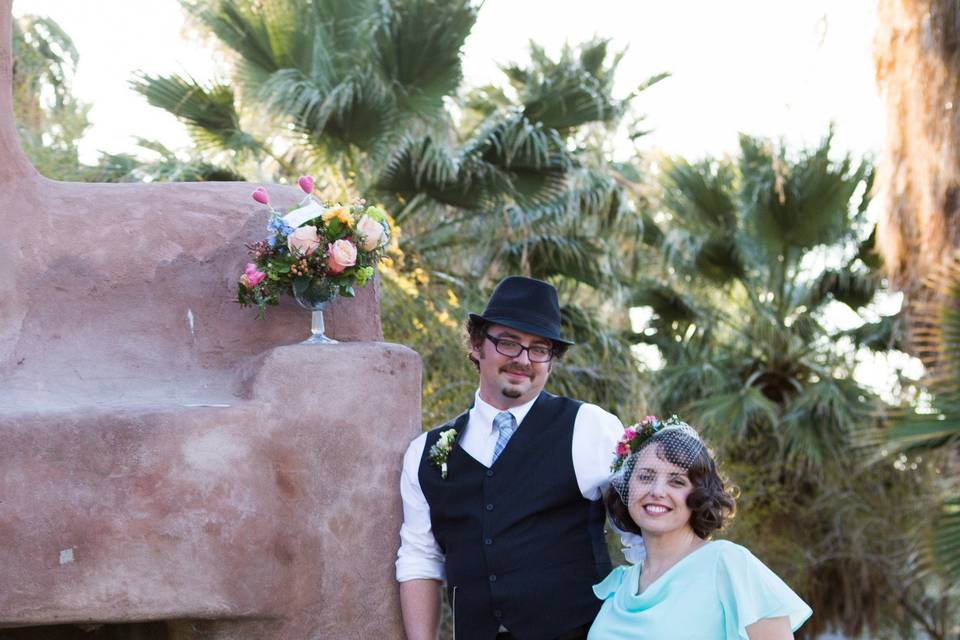 Pop of springtime colors from this bridal bouquet at a desert oasis.