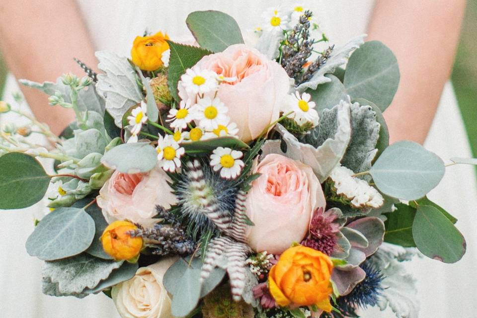 A little bit of everything including cruelty-free feathers and dried lavender for this vegan bride.