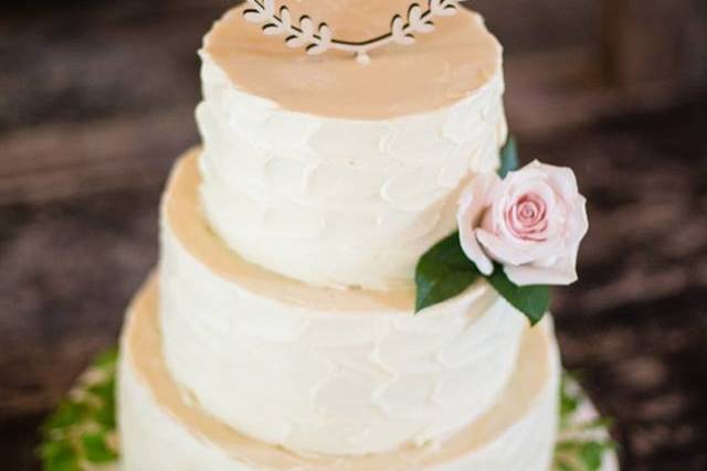 Buttercream wedding cake with topper