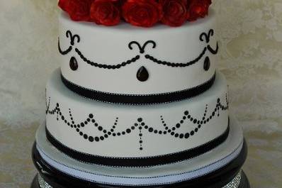 Elegant and striking, the red roses add drama to this wedding cake.