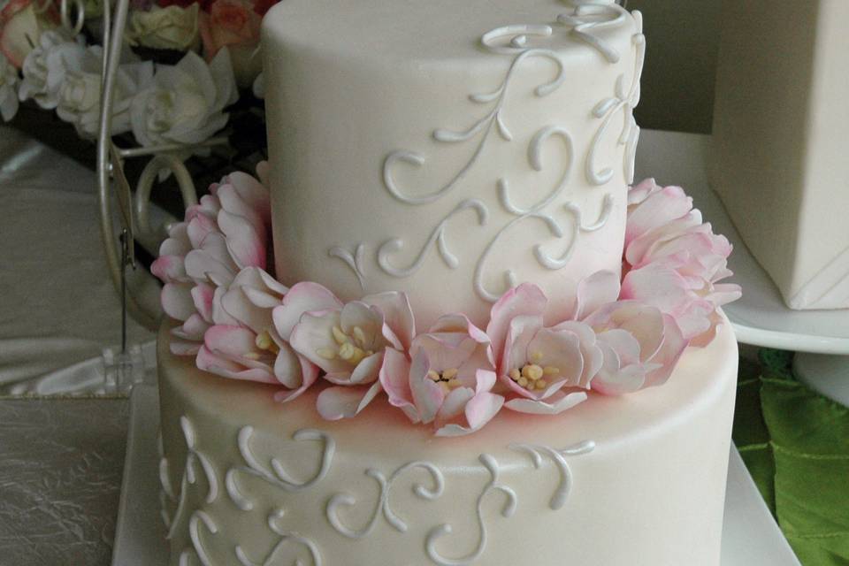 Cascading scroll with pink sugar tulips