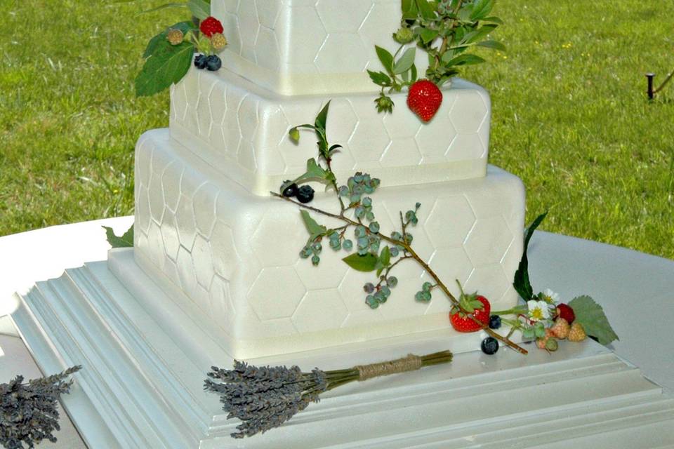 Honeycomb embossed design - Bride's parents produce honey, and the blueberry branches and raspberry and strawberry plant clippings are from the family garden.