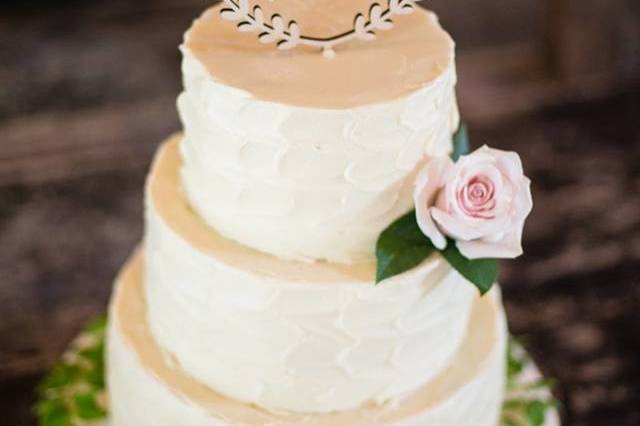 Buttercream wedding cake with topper
