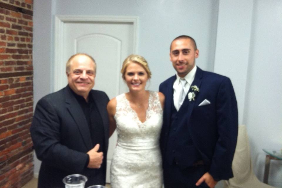 Newlyweds with officiant