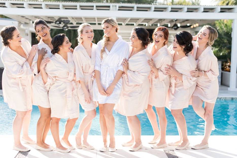 Bride and bridesmaids by the pool