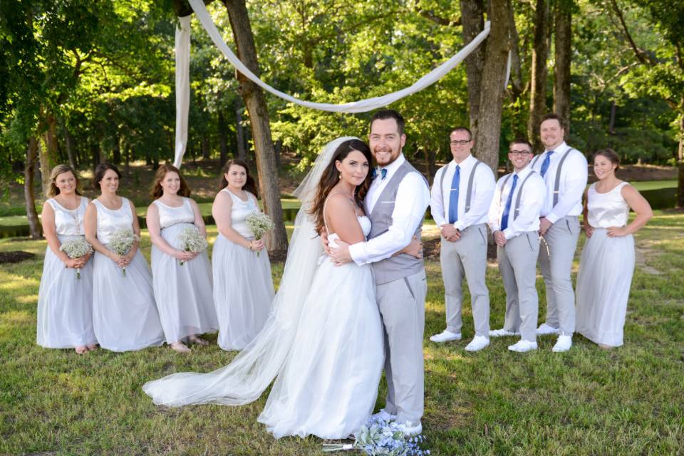 The couple with the bridesmaids and groomsmen