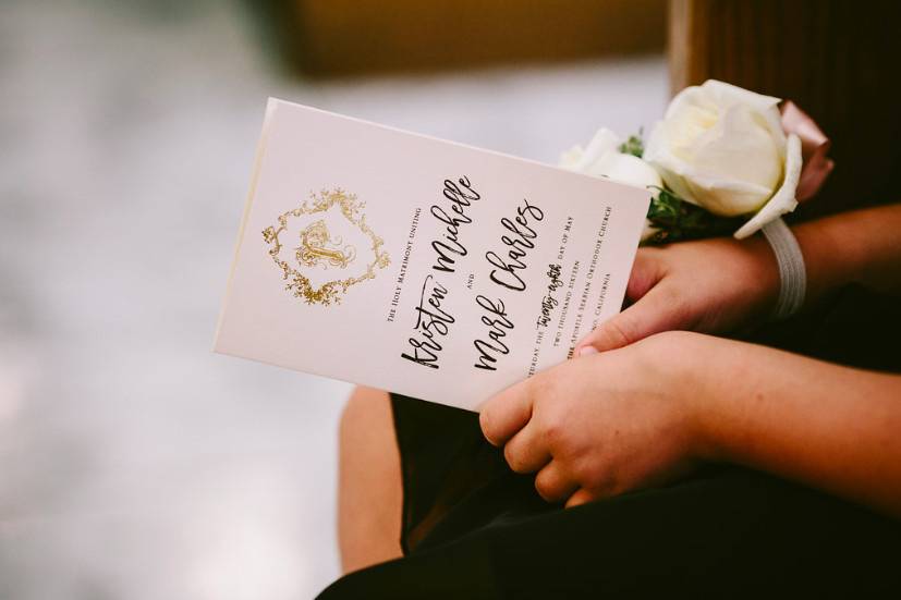 Custom wedding programs with a gold foil stamped monogram