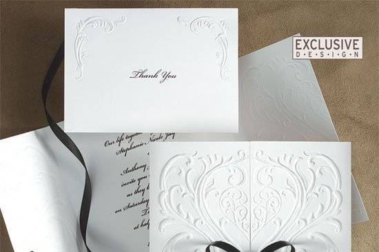 Versailles Wedding Invitations
AV845
A romantic heart surrounded by filigree is richly blind embossed on this invitation. Untie the satin bow and open the card to reveal your words of invitation.
http://www.theamericanwedding.com/shopping/prod_detail/main.asp?pid=7005