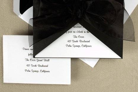 Tied With Love Wedding Invitations
AV1102
A heavyweight Black wrap envelopes a White square card personalized with your initials and words of invitation. It all ties together with a wide sheer ribbon.
http://www.theamericanwedding.com/shopping/prod_detail/main.asp-pid-6619