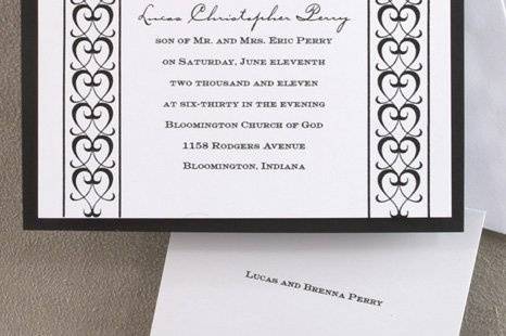 A Formal Affair Wedding Invitations
AV636
A matte black card layered with a slightly smaller white card, which is printed with your wedding invitation wording and a vertical heart-shaped scroll design.
http://www.theamericanwedding.com/shopping/prod_detail/main.asp-pid-3397