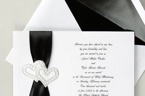 Brilliant Hearts Wedding Invitations
AV1394
A lush satin ribbon accents the double hearts framed accented in Gold or Silver foil on this heavyweight romantic invitation.
http://www.theamericanwedding.com/shopping/prod_detail/main.asp-pid-7788