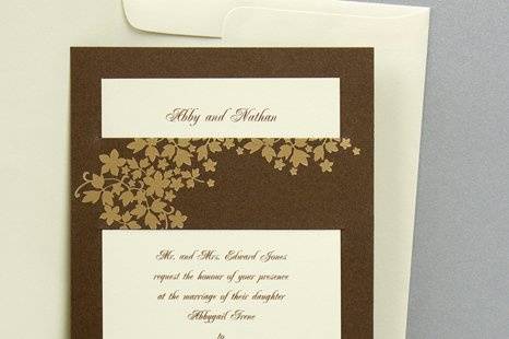 Foliage Wedding Invitations
AV1396
Elegant foil foliage is prominent on this layered invitation. Your words of invitation are printed on a single card with your first names at the top. This card slips into the backer, which is decorated on the band with more foliage.
http://www.theamericanwedding.com/shopping/prod_detail/main.asp-pid-7773
