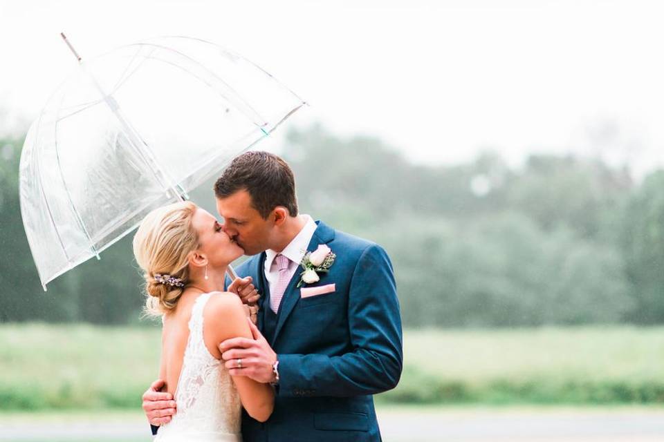 Groom kissing his bride