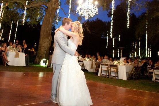 Newlyweds kissing on the dance floor