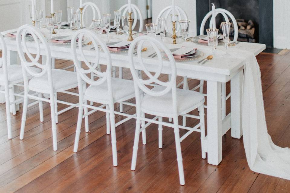 White infinity chair and white farm table