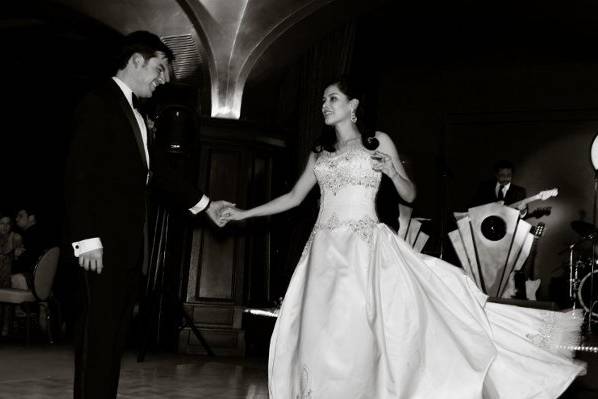 The bride and groom dancing