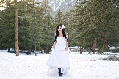 Bride walking in snow with black boots