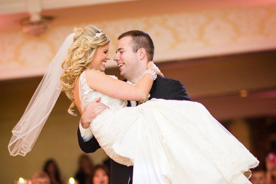 Groom carrying bride