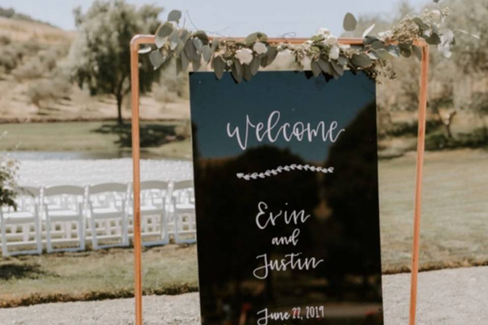 Welcome sign on copper pipe