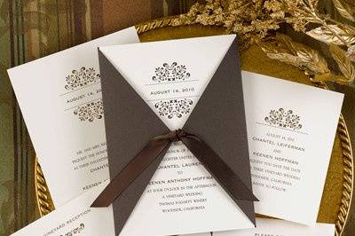 This ecru tiffany invitation card features an elegant lazer-cut design that is enclosed in a mocha wrap and tied together with a 12
