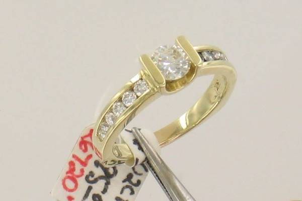 Bridal Ring with Round center tension look and channel band - available in yellow or white and any size diamond