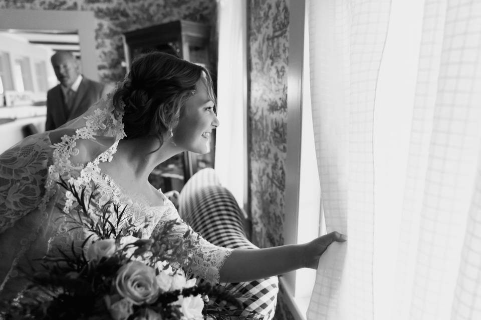 Bride peering through window