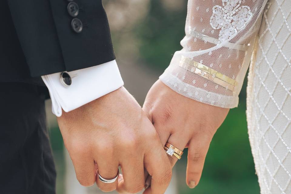 Wedding ring holding hands