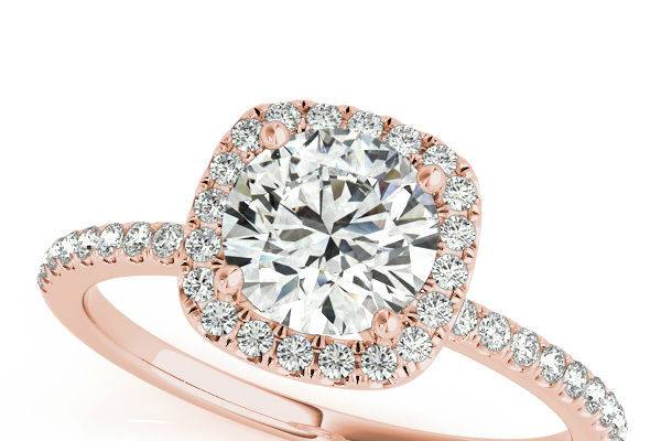 Rose Gold Halo Engagement rings in Dallas at Diamond Exchange Dallas.  Diamond Exchange Dallas stocks a large collection of wholesale engagement rings.  Find out more about our specials at http://diamondexchangedallas.com